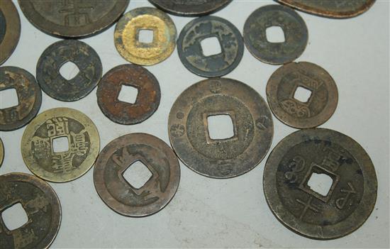 A collection of Japanese mon and half-shu coins and Chinese bronze and copper coins, 15th-19th century (23)